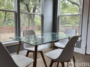 Denton house for rent - A kitchen with a stainless steel refrigerator and wooden countertops.