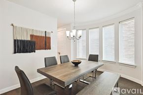 Irving house for rent - A dining room with a wooden table and chairs.