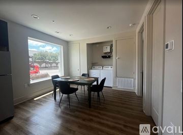 College Station apartment for rent - A kitchen with a dining table and chairs is available for rent.