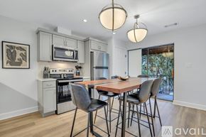 Savannah apartment for rent - A kitchen with a dining table and chairs.