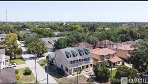 Winter Park townhouse for rent - A bird's eye view of a residential area with houses and trees.