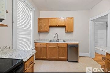 Lynchburg apartment for rent - A kitchen with wooden cabinets and a granite countertop.