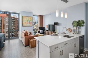 Chicago apartment for rent - A modern kitchen with a view of the city.