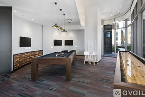 Chicago apartment for rent - A room with a pool table and a television.