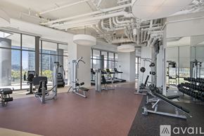 Chicago apartment for rent - A gym with a variety of equipment including weights and machines.
