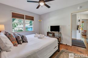 Savannah apartment for rent - A bedroom with a large bed and a television in the corner.