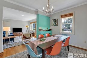 Savannah apartment for rent - A dining room with a wooden table and chairs.
