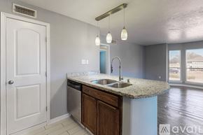 Bryan apartment for rent - A dining room with a table and chairs.
