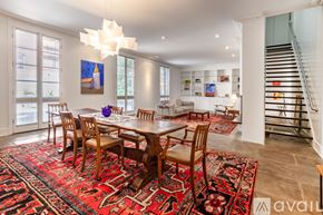 Savannah apartment for rent - A dining room with a table and chairs and a rug.