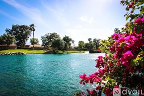 Palm Desert condo for rent - A golf course with a clubhouse in the background.