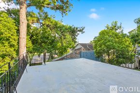 New Orleans apartment for rent - A skate park with a ramp surrounded by trees and a fence.