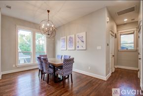 Houston house for rent - A dining room with a wooden table and chairs.