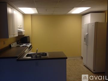 Coraopolis apartment for rent - A kitchen with a sink and a refrigerator.