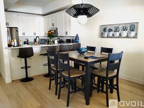 Scottsdale condo for rent - A kitchen with a table and chairs in the foreground.