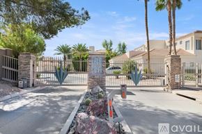 Scottsdale condo for rent - A gated community entrance with a sign that reads "AVAIL" and palm trees in the background.