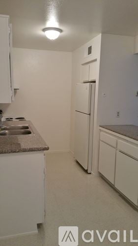 Bakersfield apartment for rent - A bathroom with a sink, toilet and mirror.
