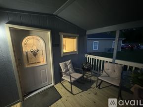 Horse Cave house for rent - A patio with a door and two chairs.