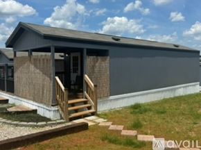 Horse Cave house for rent - A house with a grey exterior and a wooden porch.