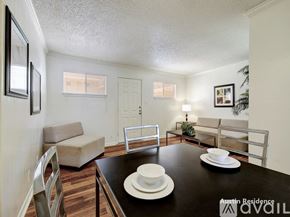 Austin apartment for rent - A dining room with a black table set for two.