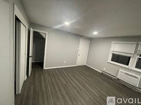 Blackwood apartment for rent - A room with a window and a wall-mounted air conditioning unit.