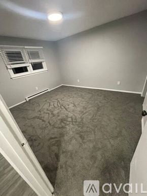 Blackwood apartment for rent - A room with a carpeted floor and a window with blinds.