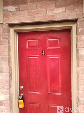 Edinburg apartment for rent - A red door with a lock and a number 4 on it.