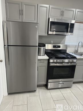 Blythe apartment for rent - A kitchen with a stainless steel refrigerator and oven.