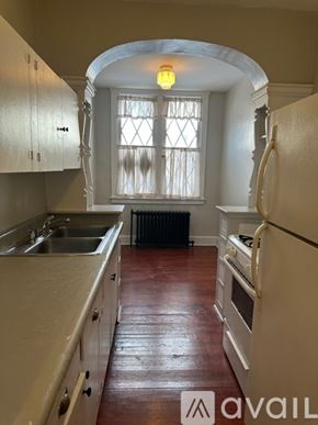 Oswego apartment for rent - A kitchen with a sink, stove, and refrigerator.