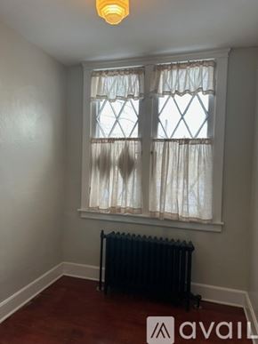 Oswego apartment for rent - A room with a window and a radiator on the floor.