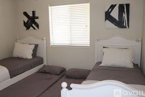 Lake Havasu City house for rent - A dining room with a table set for four and a bench.