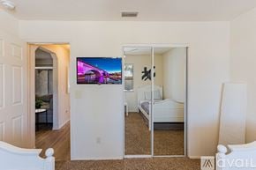 Lake Havasu City house for rent - A kitchen with wooden cabinets and a granite countertop.