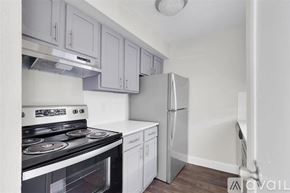 Houston apartment for rent - A kitchen with a stove, oven, and refrigerator.
