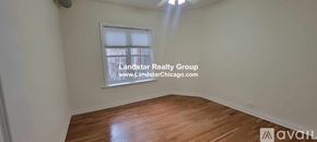 Chicago apartment for rent - A room with wooden flooring and a window showing daylight.