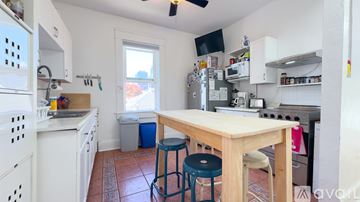 San Diego apartment for rent - A kitchen with a table and two stools.