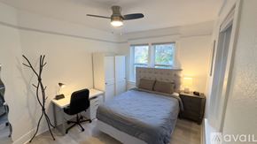 San Diego apartment for rent - A bedroom with a bed, desk, and chair.