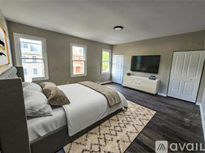 Pittsburgh house for rent - A room with a fireplace and wood flooring.