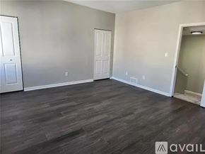 Pittsburgh house for rent - A room with wooden flooring and two doors.