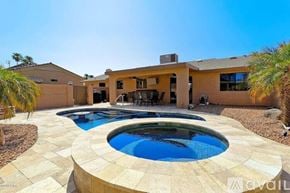 Lake Havasu City house for rent - A house with a round pool in the middle of a patio.