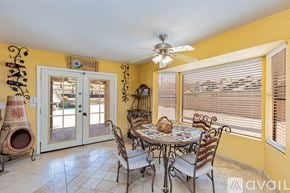 Lake Havasu City house for rent - A dining room with a table set for four.