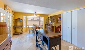 Lake Havasu City house for rent - A kitchen with a table and chairs in the middle of the room.