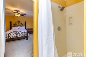 Lake Havasu City house for rent - A bedroom with a bed and a shower.