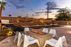 Lake Havasu City house for rent - A modern outdoor dining area with a table and chairs.