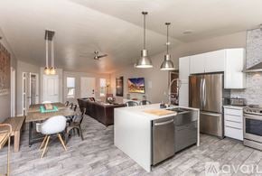 Lake Havasu City house for rent - A modern kitchen with a dining table and chairs.