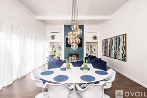 Lake Havasu City house for rent - A modern dining room with a white table and blue polka dot tablecloth.