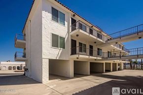 Lake Havasu City apartment for rent - A white building with a balcony and a sign that says "available".