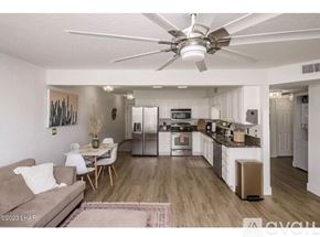 Lake Havasu City apartment for rent - A modern kitchen with a dining table and chairs.