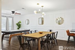 Saginaw house for rent - A dining room with a wooden table and chairs.