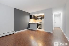 Chicago apartment for rent - A spacious kitchen with wood flooring and a modern design.