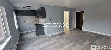 Chicago apartment for rent - A room with grey flooring and a window on the left side.