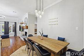 Corinth house for rent - A dining room with a wooden table and chairs.